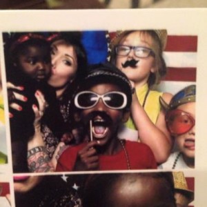 Olivia and her family in a photo booth